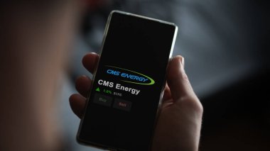 15 Ocak 2024. Değişim ekranındaki CMS Enerji logosu. CMS Enerji Fiyat Hisseleri, Bir aygıt üzerinde $CMS.
