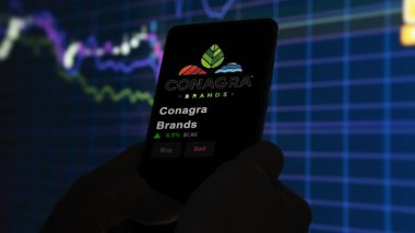 15 Ocak 2024. Conagra Markalarının logosu bir değiş tokuşun ekranında. Conagra Markaları hisse senedi fiyatları, bir cihazda CAG $.