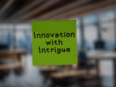 Post note on glass with 'Innovation with Intrigue'. clipart