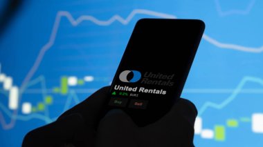 15 Ocak 2024. Bir değiş tokuş ekranında United Rentals logosu. Birleşik Kiralama hisse senetleri, bir aygıt üzerinde URI $.
