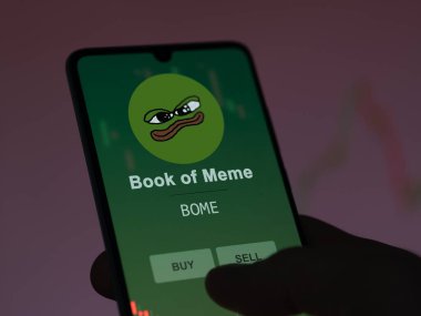 31 Mart 2024, yatırımcı Meme Kitabı 'nın fiyatını analiz ediyor. Bir borsa telefon uygulamasında yeni popüler mememecoin..