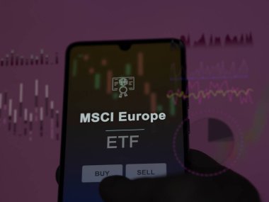 An investor analyzing the msci europe etf fund on a screen. A phone shows the prices of MSCI Europe clipart
