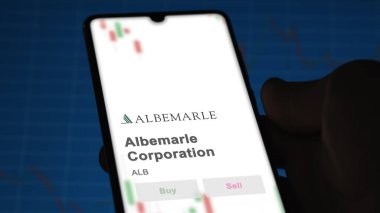 April 04th 2024. The logo of Albemarle Corporation on the screen of an exchange. Albemarle Corporation price stocks, $ALB on a device. clipart