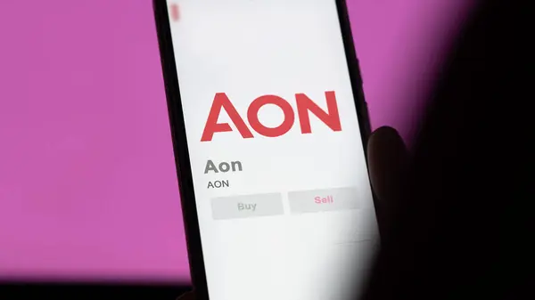 stock image April 04th 2024. The logo of Aon on the screen of an exchange. Aon price stocks, $AON on a device.