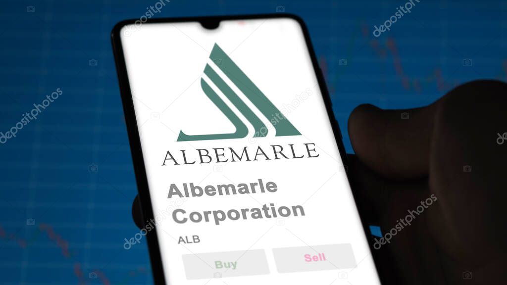 Albemarle Corporation on the screen of an exchange. Albemarle Corporation price stocks, $ALB on a device.