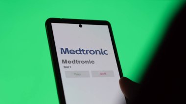 April 04th 2024. The logo of Medtronic on the screen of an exchange. Medtronic price stocks, $MDT on a device. clipart
