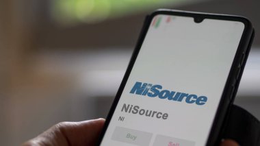 April 04th 2024. The logo of NiSource on the screen of an exchange. NiSource price stocks, $NI on a device. clipart