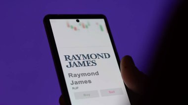 April 04th 2024. The logo of Raymond James on the screen of an exchange. Raymond James price stocks, $RJF on a device. clipart