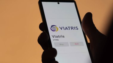 April 04th 2024. The logo of Viatris on the screen of an exchange. Viatris price stocks, $VTRS on a device. clipart