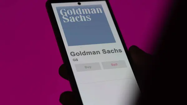 stock image April 04th 2024. The logo of Goldman Sachs on the screen of an exchange. Goldman Sachs price stocks, $GS on a device.