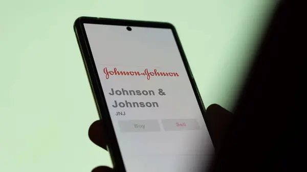 stock image April 04th 2024. The logo of Johnson n Johnson on the screen of an exchange. Johnson & Johnson price stocks, $JNJ on a device.