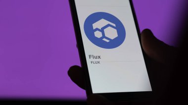 20 Nisan 2024, Şangay, Çin. Değiş tokuş ekranındaki FLUX akışının logosuna yaklaş. (FLUX) Akış fiyat hisseleri, bir aygıt üzerinde FLUX $.