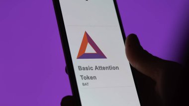 20 Nisan 2024, Şangay, Çin. Bir değiş tokuş ekranındaki Temel Dikkat Token logosuna yaklaş. Temel Dikkat Jeton fiyatları hisse senetleri, bir cihaza BAT $.