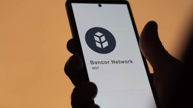 20 Nisan 2024, Şangay, Çin. Bancor Network 'ün logosunu bir değiş tokuş ekranında kapatın. (BNT) Bancor Ağ fiyat hisseleri, bir aygıt üzerinde BNT $.