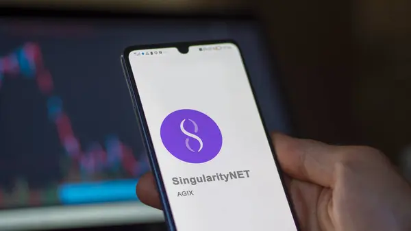 stock image April 20th 2024 , Shanghai, China. Close up on logo of (AGIX) SingularityNET on the screen of an exchange. (AGIX) SingularityNET price stocks, $AGIX on a device.