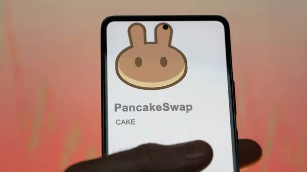 stock image April 20th 2024 , Shanghai, China. Close up on logo of (CAKE) PancakeSwap on the screen of an exchange. (CAKE) PancakeSwap price stocks, $CAKE on a device.