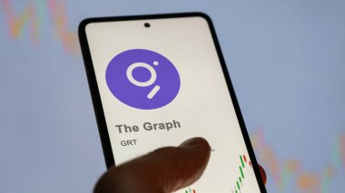 20 Nisan 2024, Şangay, Çin. Bir değiş tokuş ekranındaki grafiğin logosuna yaklaş. Grafik fiyatı hisseleri, bir cihaza GRT $.