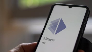 Değiş tokuş ekranında Altlayer 'ın logosuna yaklaş. Altlayer hisse senetleri, bir cihaza ALT $.