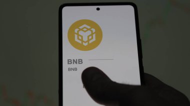 Değiş tokuş ekranında BNB (BNB) logosunu kapat. (BNB) Fiyat hisseleri, cihaza BNB $.