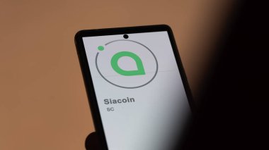 Siacoin 'in (SC) logosunu bir takas ekranında kapatın. (SC) Siacoin fiyat hisseleri, bir cihaza SC $.