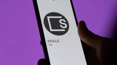 Bir takas ekranında (SKL) SKALE logosunu kapat. (SKL) SKALE fiyat hisseleri, bir aygıt üzerinde $SKL.