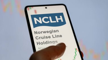 April 09th 2024 , Miami, Florida. Close up on logo of Norwegian Cruise Line Holdings on the screen of an exchange. Norwegian Cruise Line Holdings price stocks, $NCLH on a device. clipart