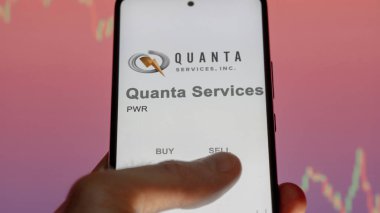 April 09th 2024 , Houston, Texas. Close up on logo of Quanta Services on the screen of an exchange. Quanta Services price stocks, $PWR on a device. clipart