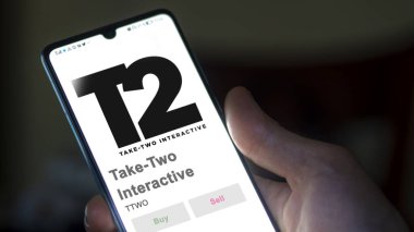 April 09th 2024 , New York City, New York. Close up on logo of Take-Two Interactive on the screen of an exchange. Take-Two Interactive price stocks, $TTWO on a device. clipart