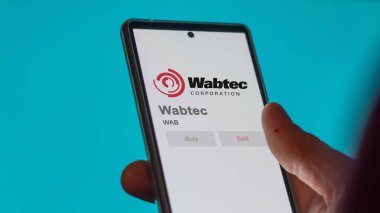 April 09th 2024 , Pittsburgh, Pennsylvania. Close up on logo of Wabtec on the screen of an exchange. Wabtec price stocks, $WAB on a device. clipart