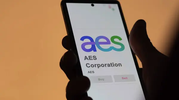 stock image April 09th 2024 , Arlington, Virginia. Close up on logo of AES Corporation on the screen of an exchange. AES Corporation price stocks, $AES on a device.