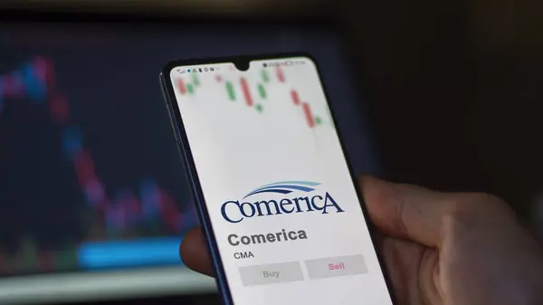 stock image April 09th 2024 , Dallas, Texas. Close up on logo of Comerica on the screen of an exchange. Comerica price stocks, $CMA on a device.