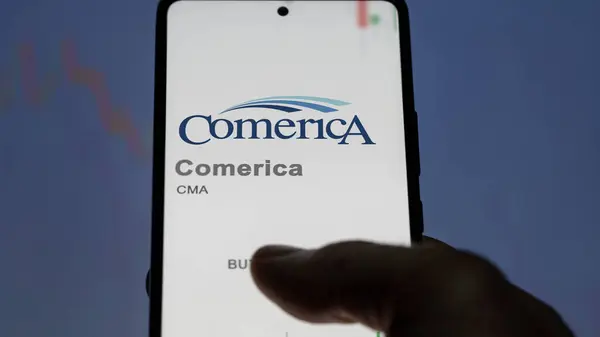 stock image April 09th 2024 , Dallas, Texas. Close up on logo of Comerica on the screen of an exchange. Comerica price stocks, $CMA on a device.