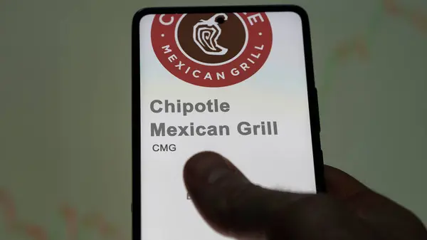 stock image April 09th 2024 , Newport Beach, California. Close up on logo of Chipotle Mexican Grill on the screen of an exchange. Chipotle Mexican Grill price stocks, $CMG on a device.