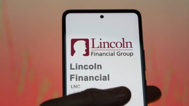 April 09th 2024 , Radnor, Pennsylvania. Close up on logo of Lincoln Financial on the screen of an exchange. Lincoln Financial price stocks, $LNC on a device. clipart