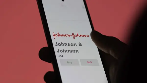 stock image April 09th 2024 , New Brunswick, New Jersey. Close up on logo of Johnson & Johnson on the screen of an exchange. Johnson & Johnson price stocks, $JNJ on a device.