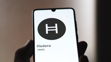 April 17th 2024 , Shanghai, China. Close up on logo of (HBAR) Hedera on the screen of an exchange. (HBAR) Hedera price stocks, $HBAR on a device. clipart