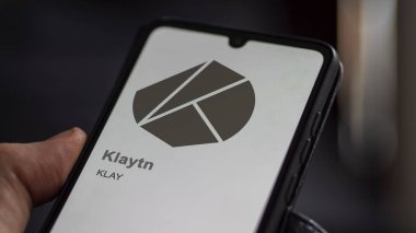 April 17th 2024 , Shanghai, China. Close up on logo of (KLAY) Klaytn on the screen of an exchange. (KLAY) Klaytn price stocks, $KLAY on a device. clipart