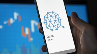 April 17th 2024 , Shanghai, China. Close up on logo of (QTUM) Qtum on the screen of an exchange. (QTUM) Qtum price stocks, $QTUM on a device. clipart