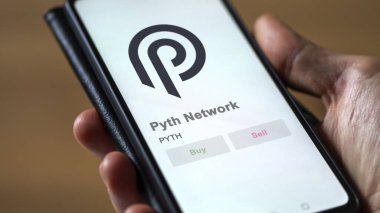 Bir takas ekranındaki PYTH Pyth Ağı logosuna yaklaş. PYTH Pyth Ağ Fiyat Hisseleri, Bir aygıt üzerinde $PYTH.