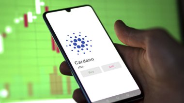 Değiş tokuş ekranındaki bölge savcısı yardımcısı Cardano 'nun logosuna yaklaş. ADA cardano hisse senetleri, bir cihaza $ADA.