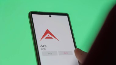 Bir değiş tokuş ekranında ARK Ark 'ın logosuna yaklaş. Ark 'ın hisse senetleri, bir cihazda ARK $.