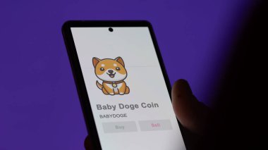 Bir değiş tokuş ekranında Bebek Doge Coin 'in logosuna yaklaş. Bebek Doge madeni para senetleri, bir cihazın üzerindeki bebek bakımı.