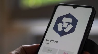 Close up on logo of CRO cronos on the screen of an exchange. CRO cronos price stocks, $CRO on a device. clipart