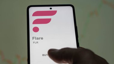 Close up on logo of FLR Flare on the screen of an exchange. FLR Flare price stocks, $FLR on a device. clipart