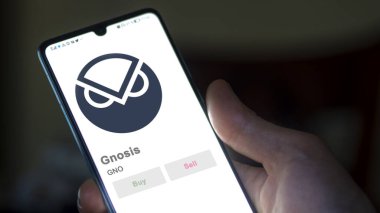 Değiş tokuş ekranındaki GNO Gnosis logosuna yaklaş. GNO Gnosis fiyat hisseleri, bir cihaza GNO $.