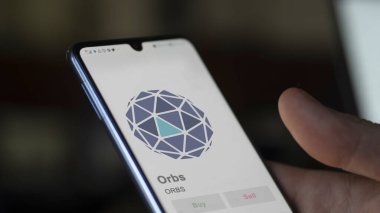 Değiş tokuş ekranındaki ORBS kürelerinin logosuna yaklaş. ORBS Küreleri hisse senetleri, bir aygıt üzerinde ORBS $.