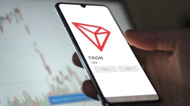TRX TRON 'un logosunu bir değiş tokuş ekranında kapat. TRX TRON fiyat hisseleri, bir aygıt üzerinde $TRX.