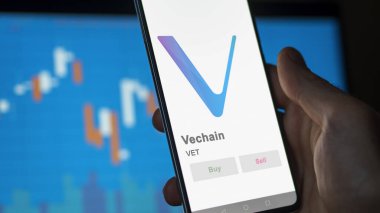 Veteriner Vechain 'in logosuna yakın çekim bir değiş tokuş ekranında. Veteriner Vechain hisse senetleri, bir cihazın veterineri..
