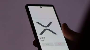 Takas ekranındaki XRP XRP logosunu kapat. XRP XRP fiyat hisseleri, bir aygıt üzerinde $XRP.