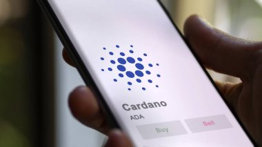 Değiş tokuş ekranındaki bölge savcısı yardımcısı Cardano 'nun logosuna yaklaş. ADA cardano hisse senetleri, bir cihaza $ADA.